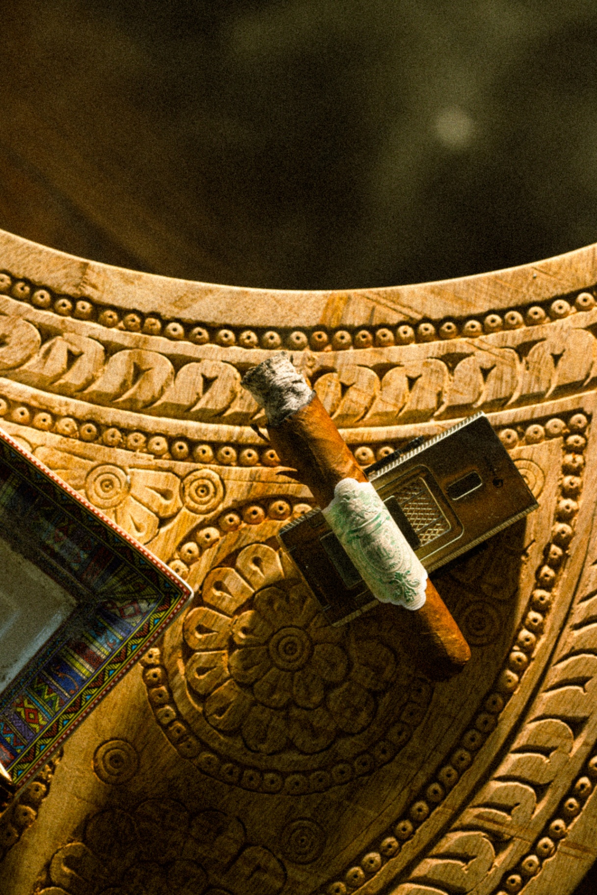 Cigar on carved table